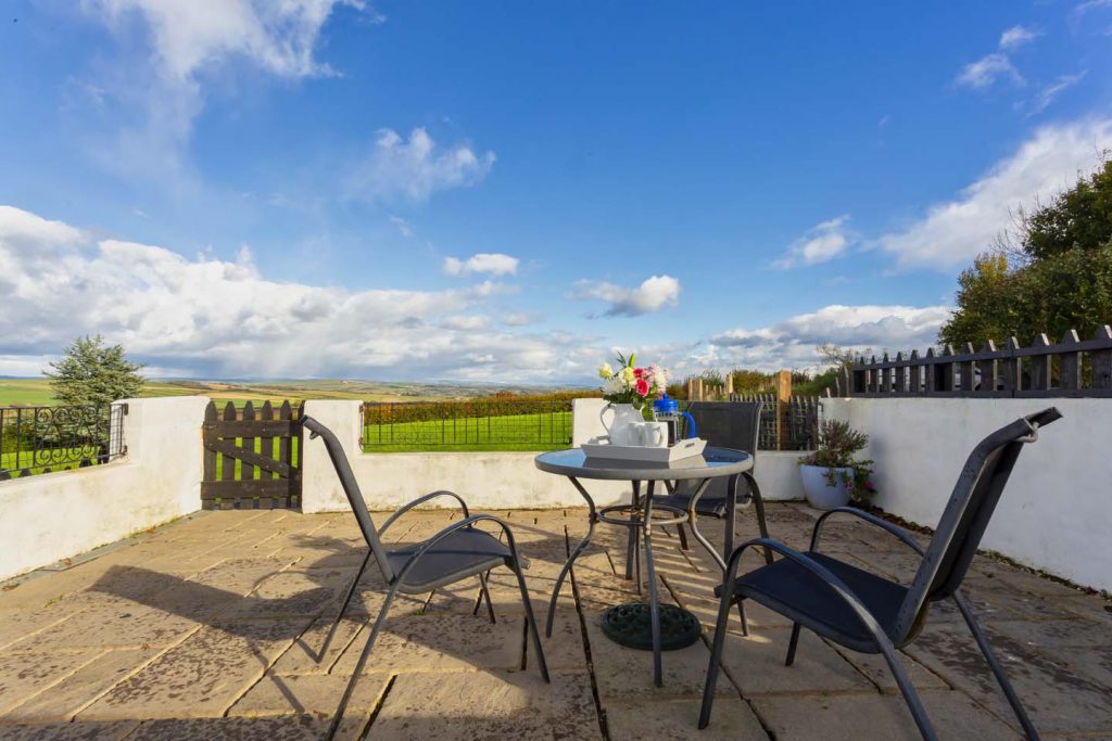 Owl cottage outside table and paddock